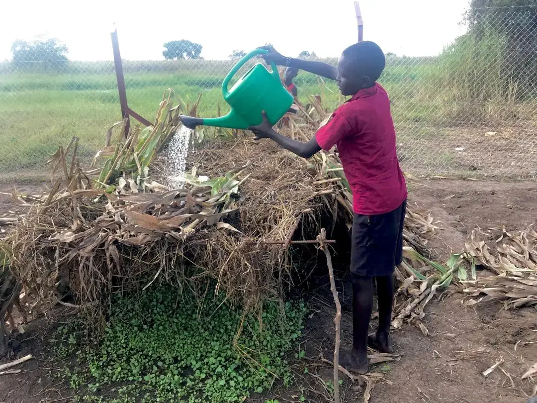 A community member tending a productive garden