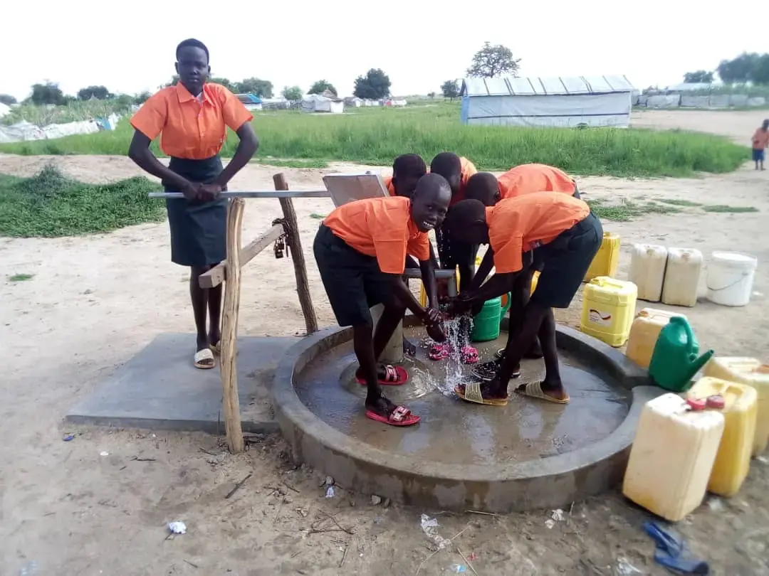 Children collecting water from a school water point